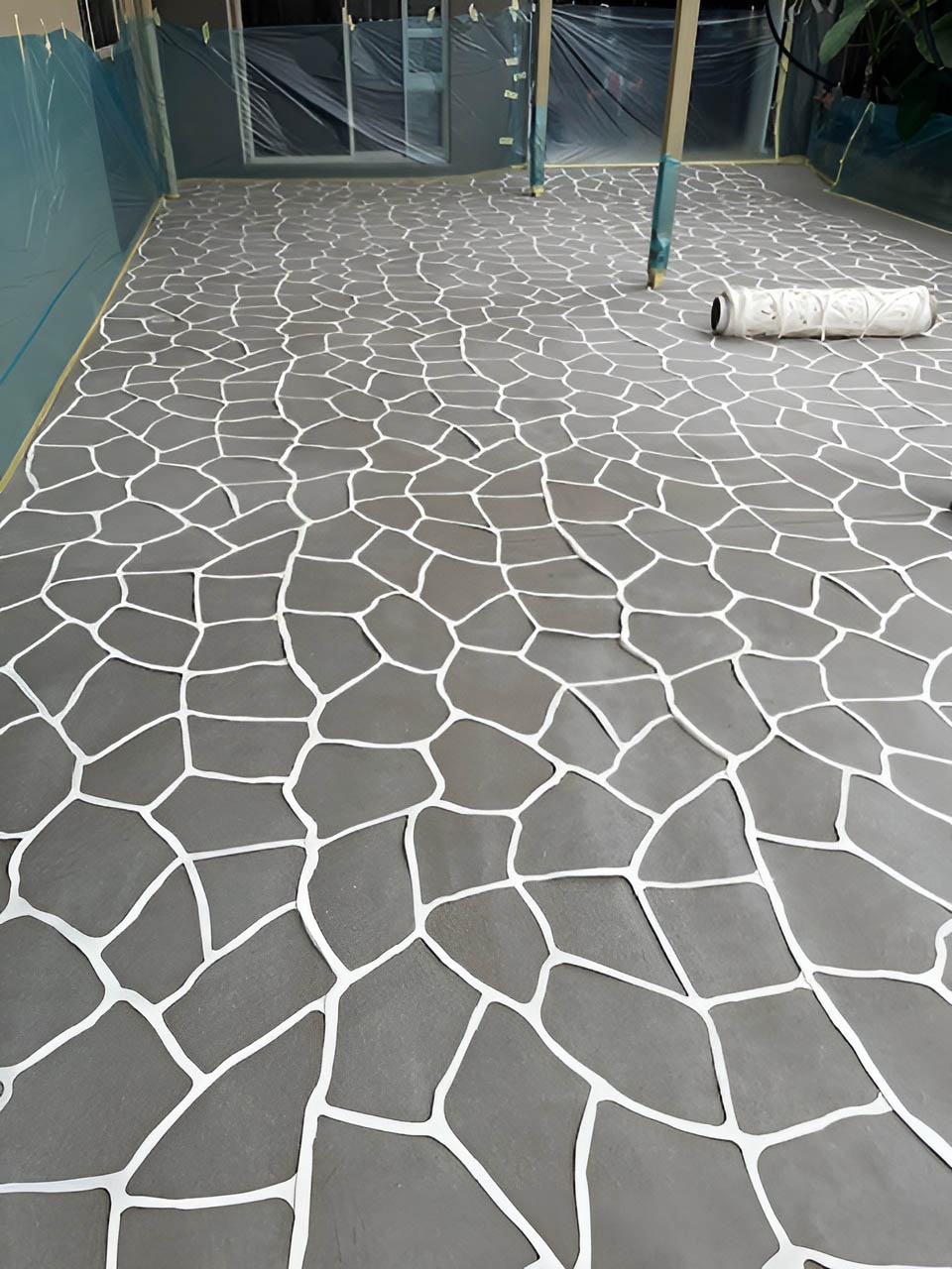 Grey crazy-paving pattern concrete on a covered patio