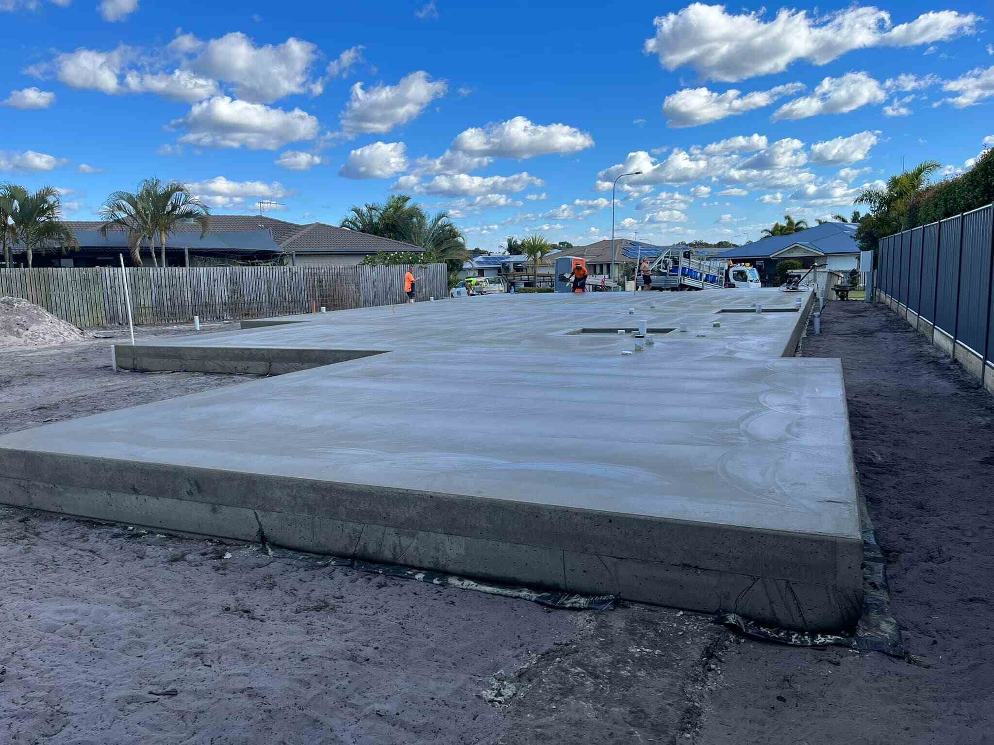 Large concrete house slab on a cleared block, wide view